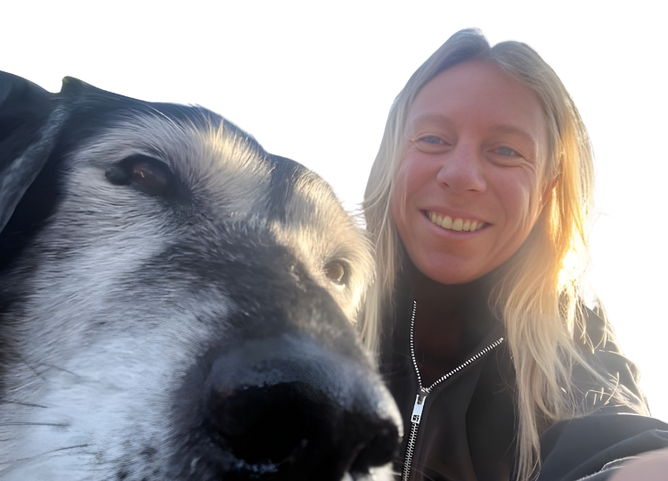 dog walker smiling with dog